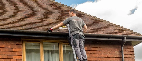 our team cleaning the gutters on a house in Stoke Bishop, Colchester